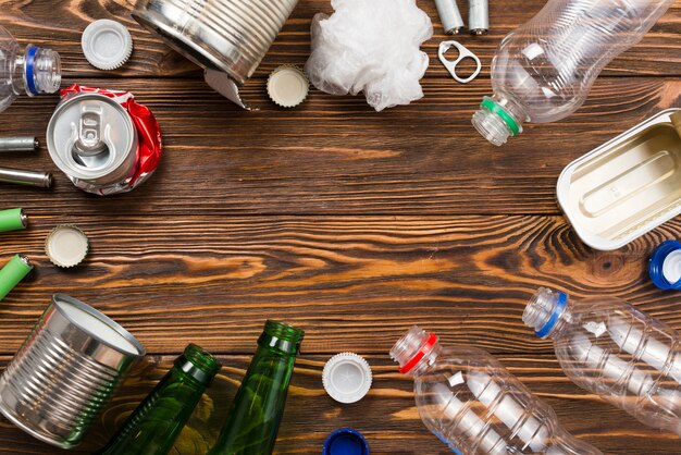 Layout of garbage for recycling on wooden background