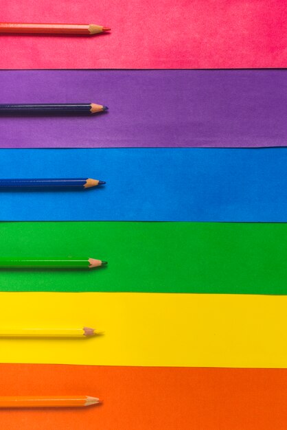 Layout of pencils and bright LGBT flag