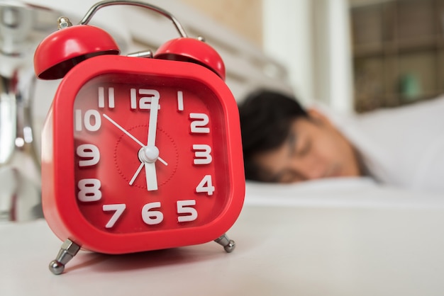 Lazy Man waking up in his bedroom