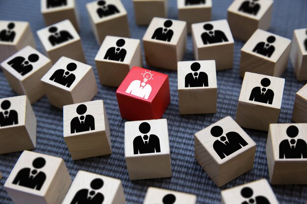 Leadership graphics icons on wooden blocks.