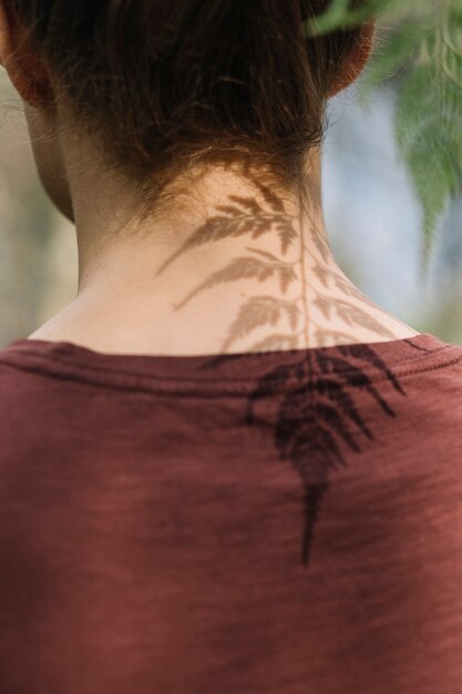 Leaf casting a shadow on man