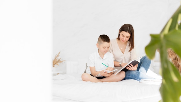 Learning from home tutor and child writing