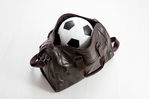 Leather bag packed with football