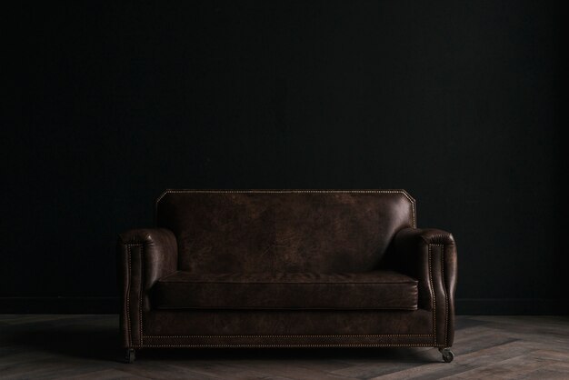 Leather couch in dark room
