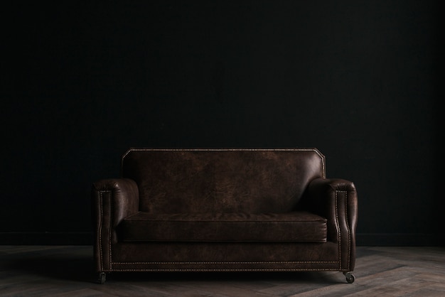 Leather couch in dark room