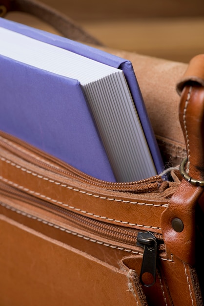 Leather handbag with book