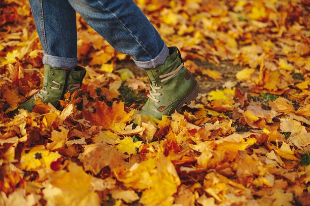 Leather shoes walking on fall leaves Outdoor