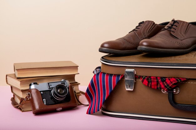 Leather suitcase packed with shoes and clothes