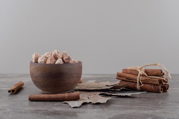 Leaves, confectionery and cinnamons on the marble surface