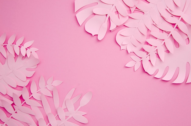 Free photo leaves made out of paper in pink shades