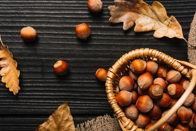 Free photo leaves near basket with nuts