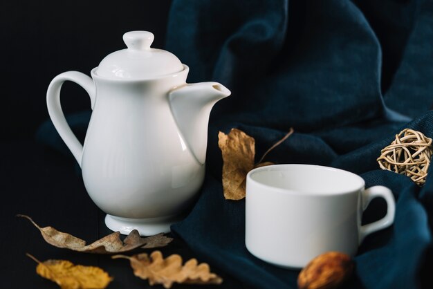 Leaves near teapot and cup