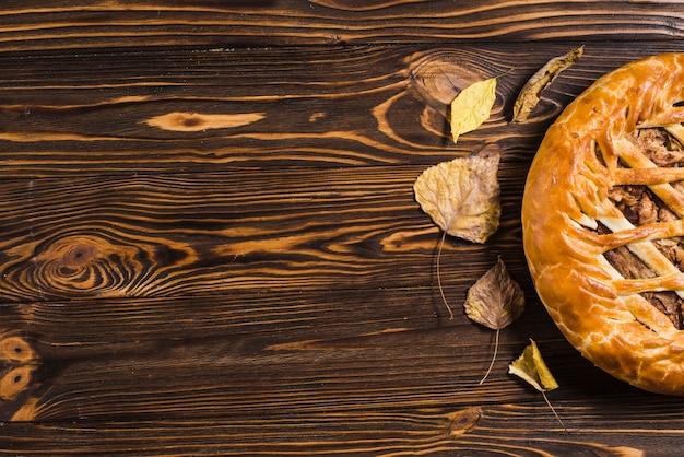 Leaves and pie on table