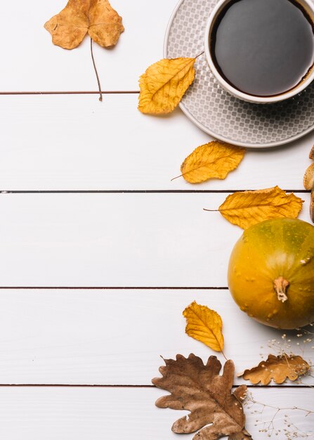 Leaves and squash near beverage