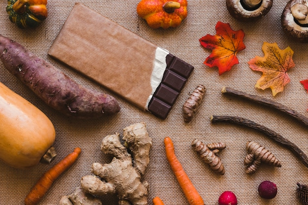 Leaves and vegetables lying near chocolate