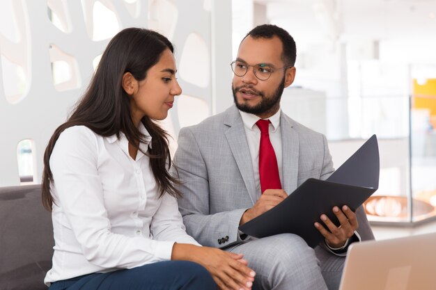 Legal expert explaining document specifics to customer