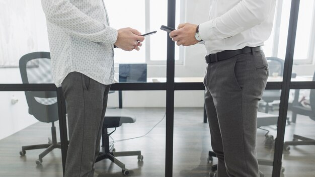 Legs of business people in office