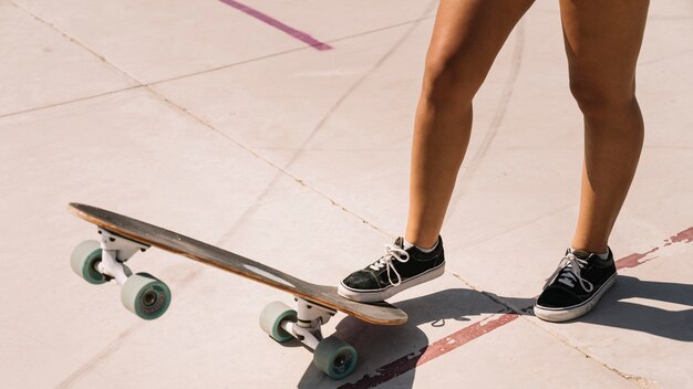 Legs of girl with skateboard