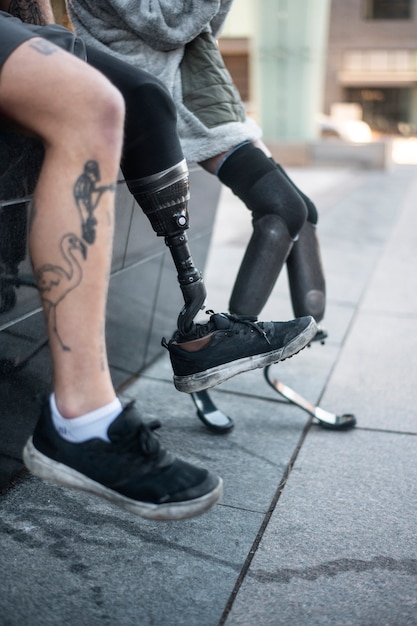 Free photo legs of man and woman with disabilities