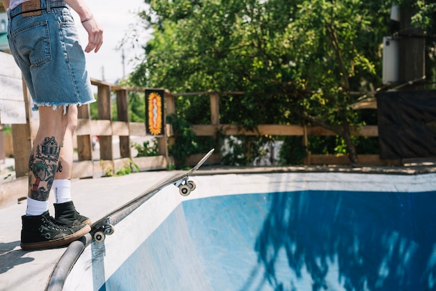 Legs of skateboarder preparing to ride