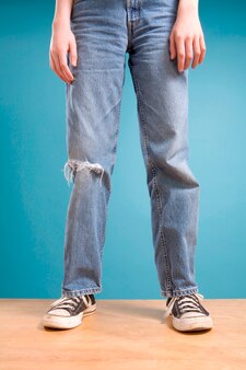 Premium Photo | Legs of teen boy in ripped jeans