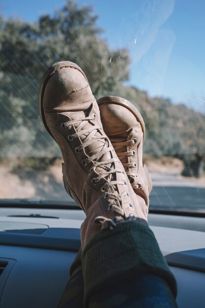 Legs of tourist at dashboard