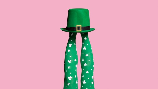 Free photo legs wearing green socks with clovers motif