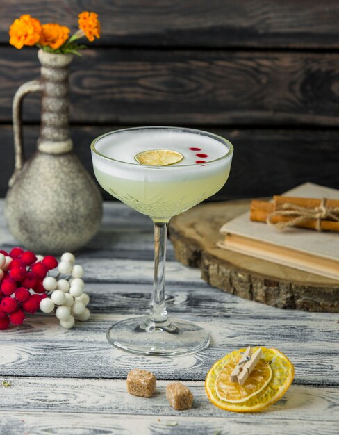 Lemon cocktail with lemon slice on the table 