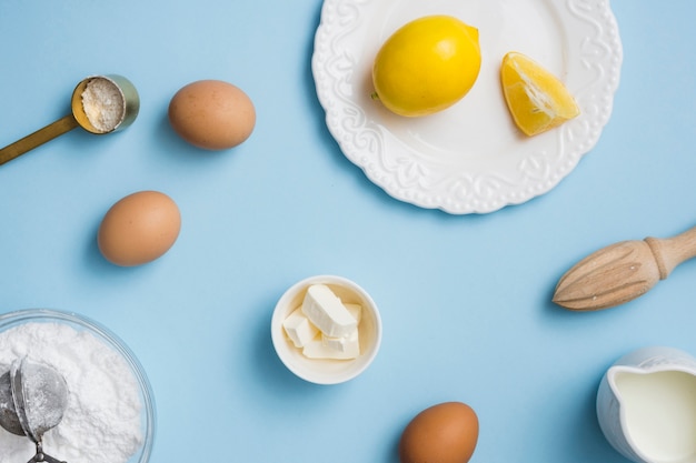 Lemon and eggs in flat lay