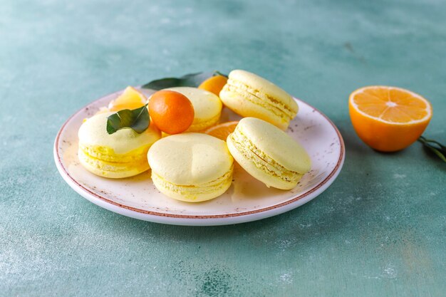 Lemon macaroons with fresh fruits.