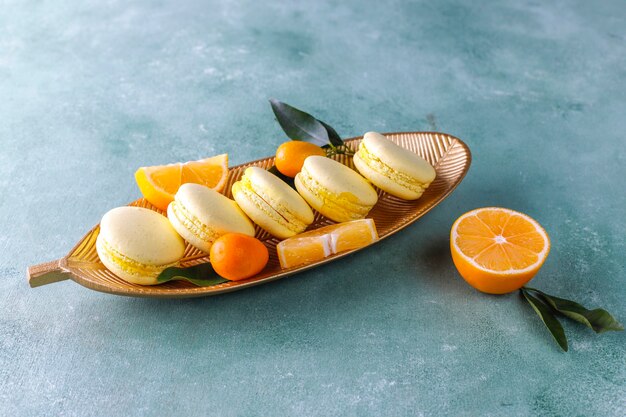 Lemon macaroons with fresh fruits.