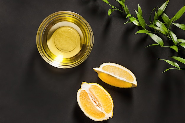 Lemon oil isolated on black table