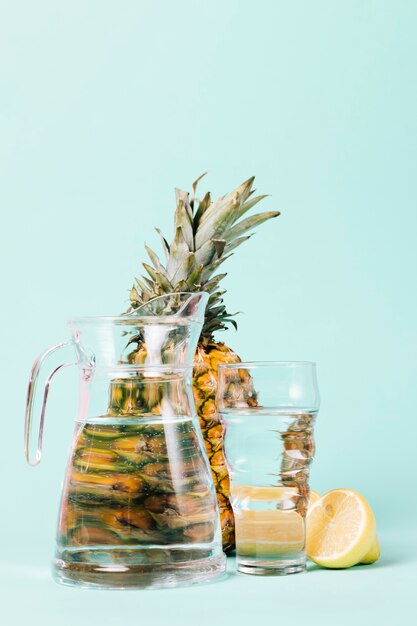 Lemon and pineapple fruit with water
