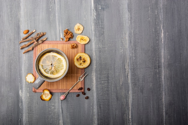 Lemon in refreshing tea flat lay