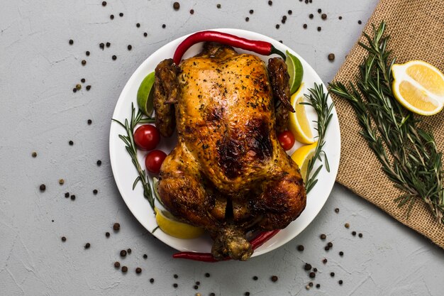 Lemon and rosemary near chicken