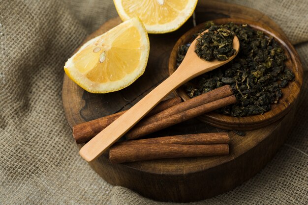 Lemon slices with cinnamon sticks and dried herb tea