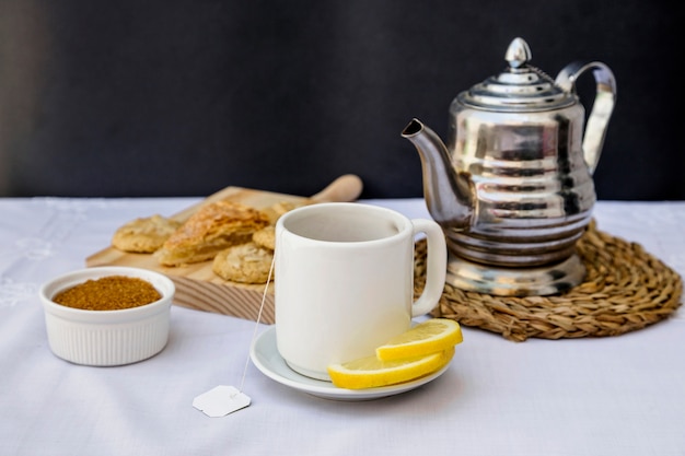 Lemon tea with brown sugar on table