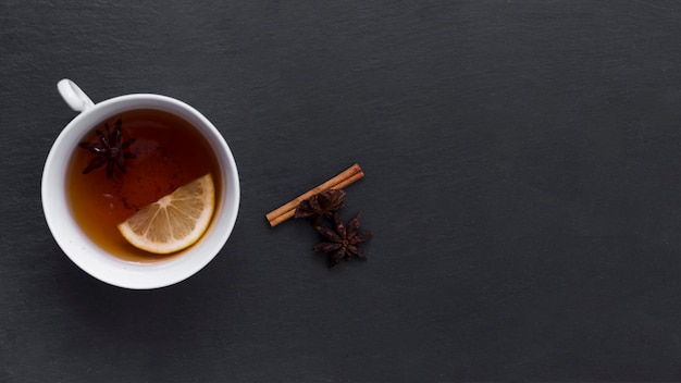 Free photo lemon tea with cinnamon and anise stars