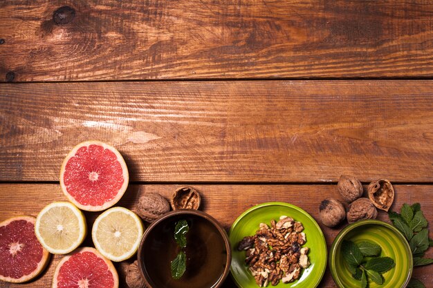 Lemon and walnut on a wooden surface close up