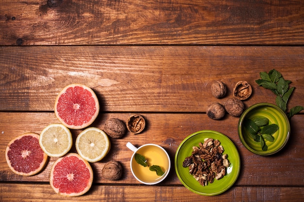 Lemon and walnut on a wooden surface close up