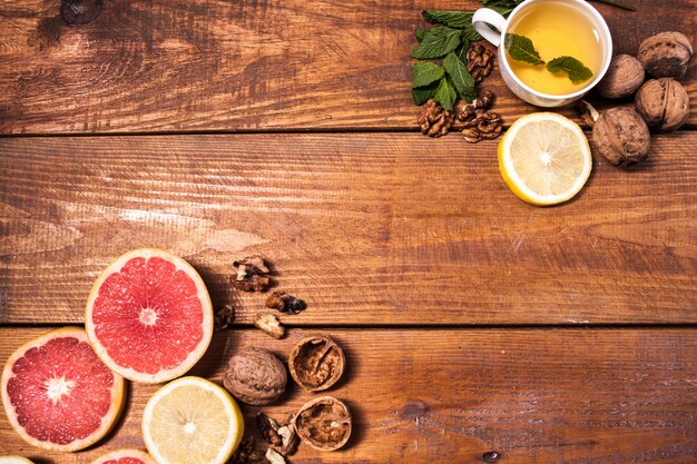 Lemon and walnut on a wooden surface close up