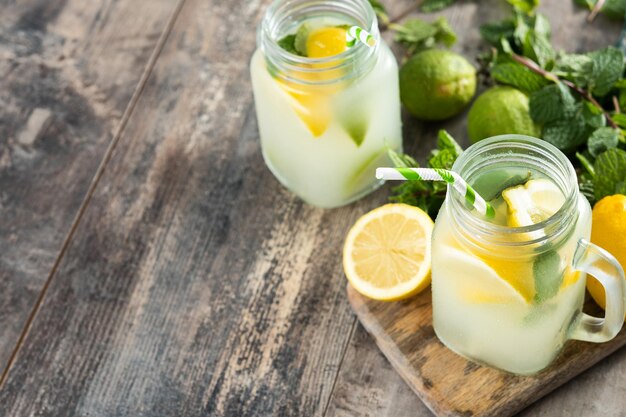 Lemonade drink in a jar glass on wooden table