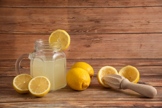 Lemonade in a glass cup on the wooden table