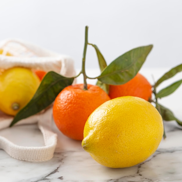 Lemons and mandarins on table