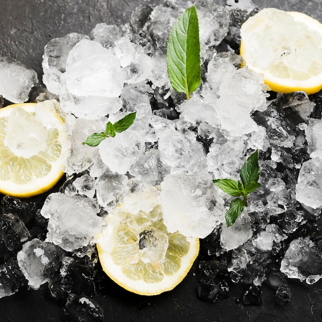 Lemons with mint and ice cubes