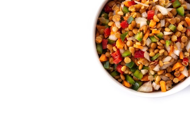 Lentil salad with peppersonion and carrot in a bowl isolated on white background