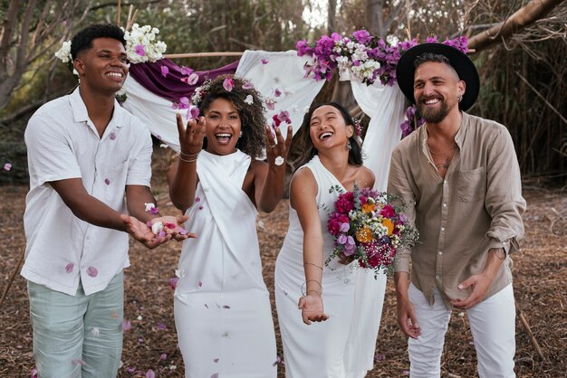 lesbian couple celebrating their wedding day with guests and friends
