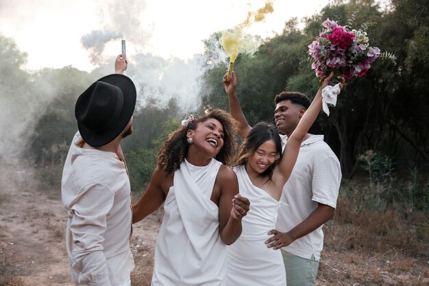 Lesbian couple celebrating their wedding day with guests and friends