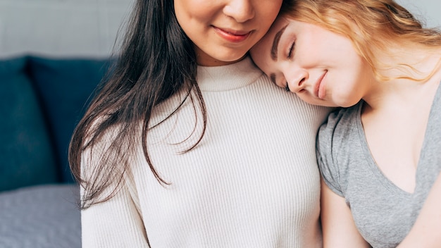 Lesbian couple hugging tenderly