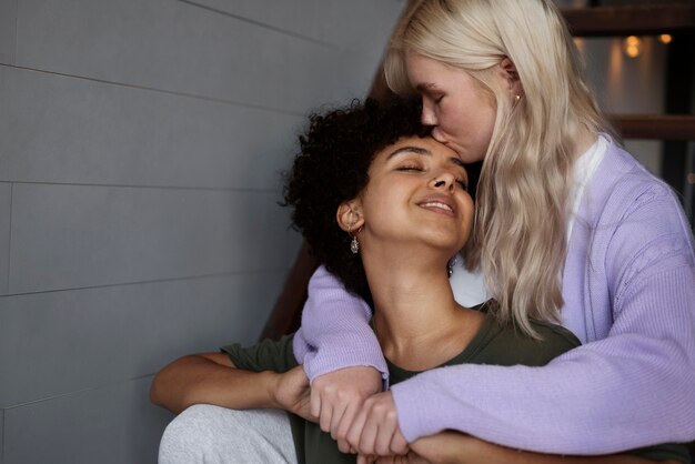 Lesbian couple kissing with copy space